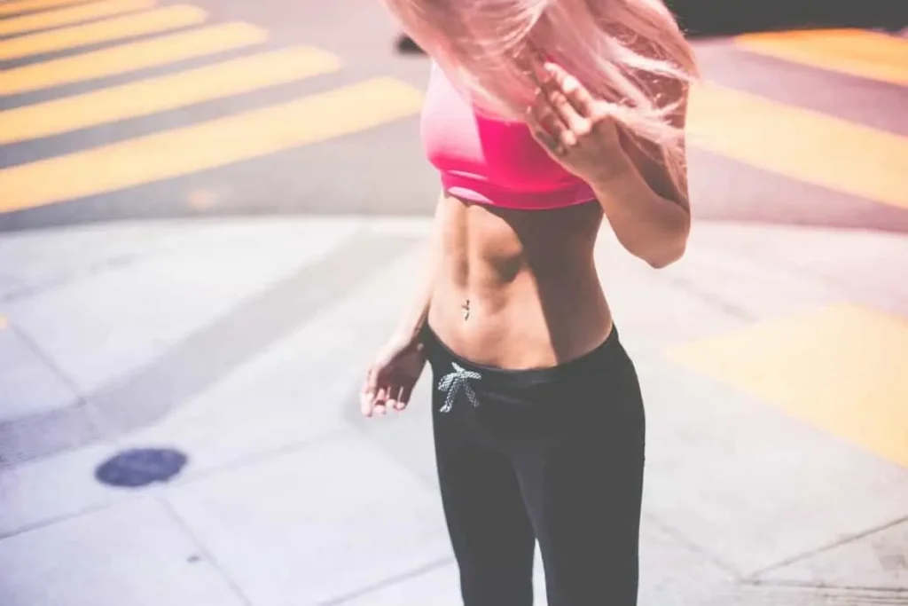 Woman with toned stomach after LA-EMS Body Sculpting Treatment Scottish