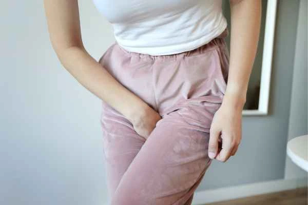 woman running for the toilet because of urinary incontinence Scottish